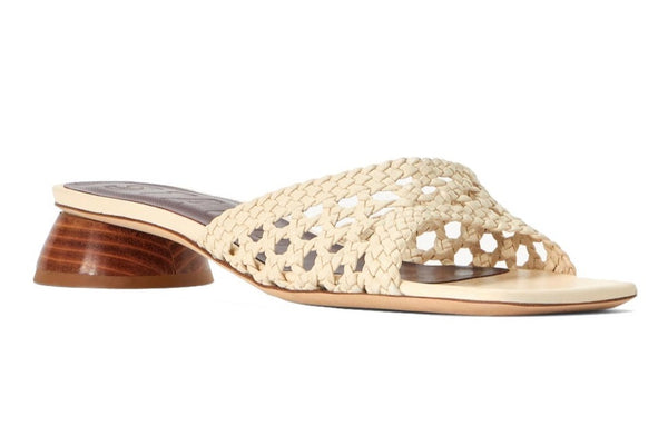 Hand woven Staud Simone Crochet Heel slide sandal with a wooden block heel on a white background.