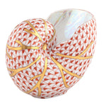 The Herend Nautilus Shell is a collectible porcelain vase featuring a red fish scale pattern and gold veining on white, showcasing timeless elegance.
