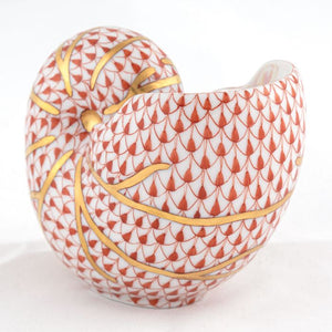 The Herend Nautilus Shell is a hand-painted porcelain figurine featuring a red fish scale pattern and gold accents on white, perfect as a collectible decorative accent.