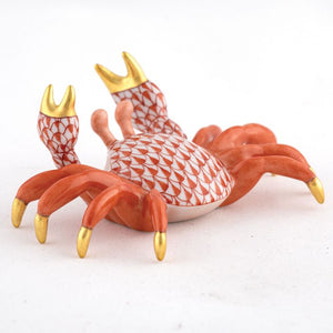 The Herend Sand Crab is a collectible porcelain figurine featuring an orange and white scale pattern with gold-tipped claws, set on a white surface—a decorative accent that brings timeless elegance to any space.