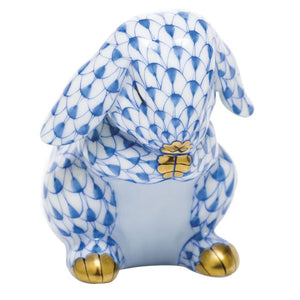 Herend's Praying Bunny figurine features a hand-painted blue fishnet pattern with gold-tipped paws and detailed craftsmanship—an exquisite example of artistic design inspired by classic Herend porcelain.