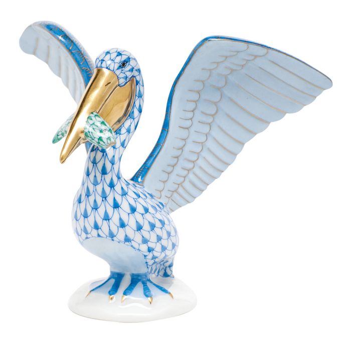 Herend's Pelican With Fish features a blue scale porcelain pattern, gold accents on the beak and feet, a white base, and raised wings—making it a timeless collectible for any decor.