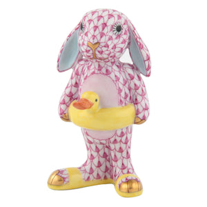 Herend Beach Bunny: a porcelain figurine featuring a pink patterned bunny with gold accents, holding a yellow duck—perfect for bringing whimsical charm to your beach-themed décor.