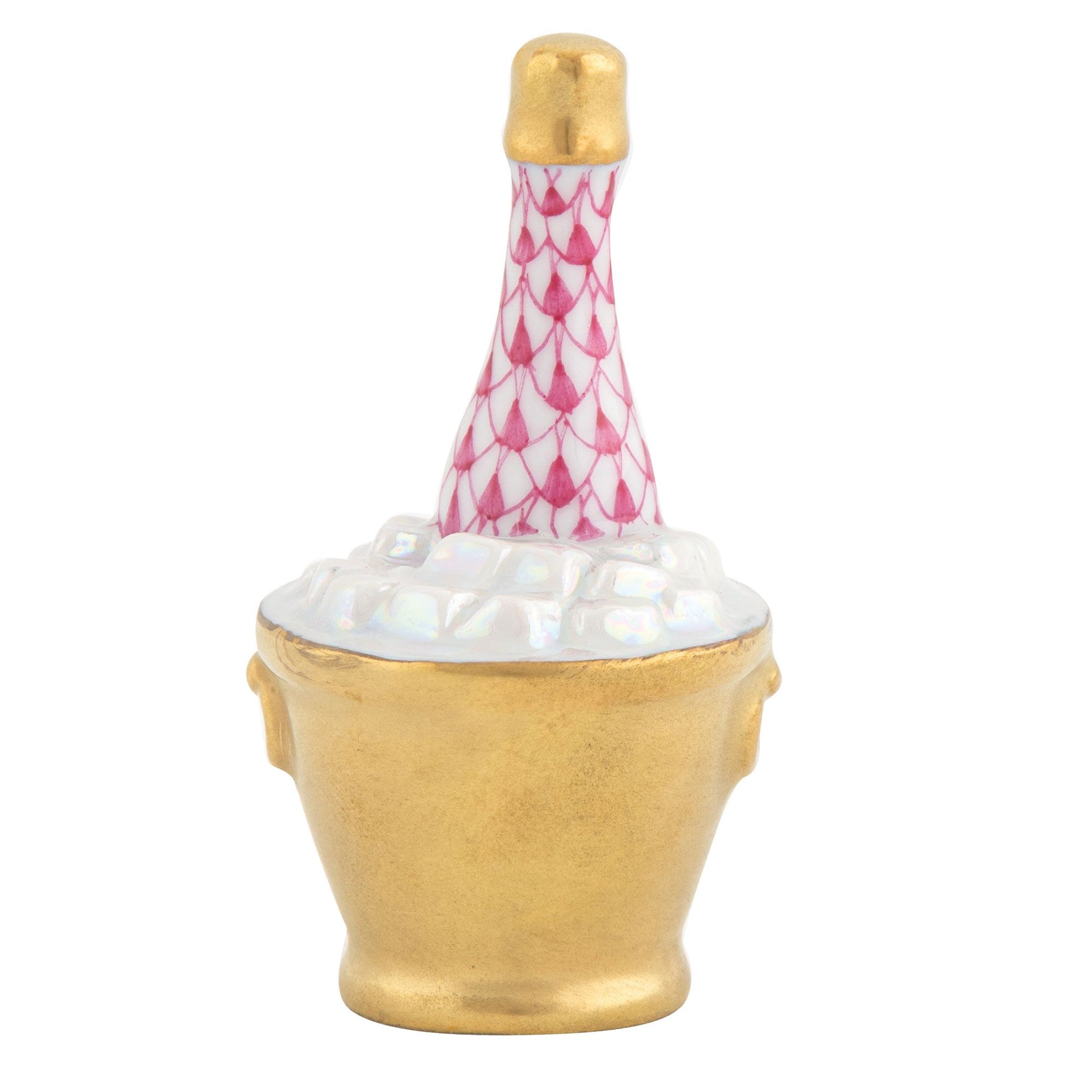 Herend’s Champagne Bucket is a durable porcelain figurine, exquisitely hand painted to resemble a pink champagne bottle nestled in a gold ice bucket with white ice cubes.