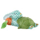 The Herend Slumber Bunny figurine, handcrafted in Hungary, depicts a patterned rabbit in the iconic fishnet motif, lying under a large green leaf with an orange carrot beside it.