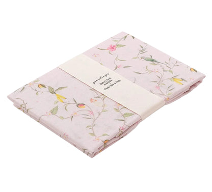 The Gooselings Dreaming of Paradise Swaddle is a soft, 100% cotton light pink floral blanket, wrapped with a cream band—perfect for gently comforting your baby.