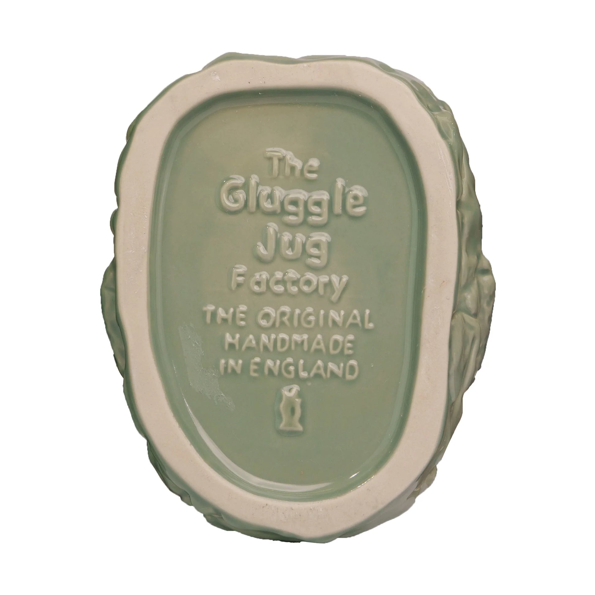 The base of a ceramic Croggle Jug reads: "The Original Gluggle Jug, Handmade in England" with a small fish logo beneath the text.