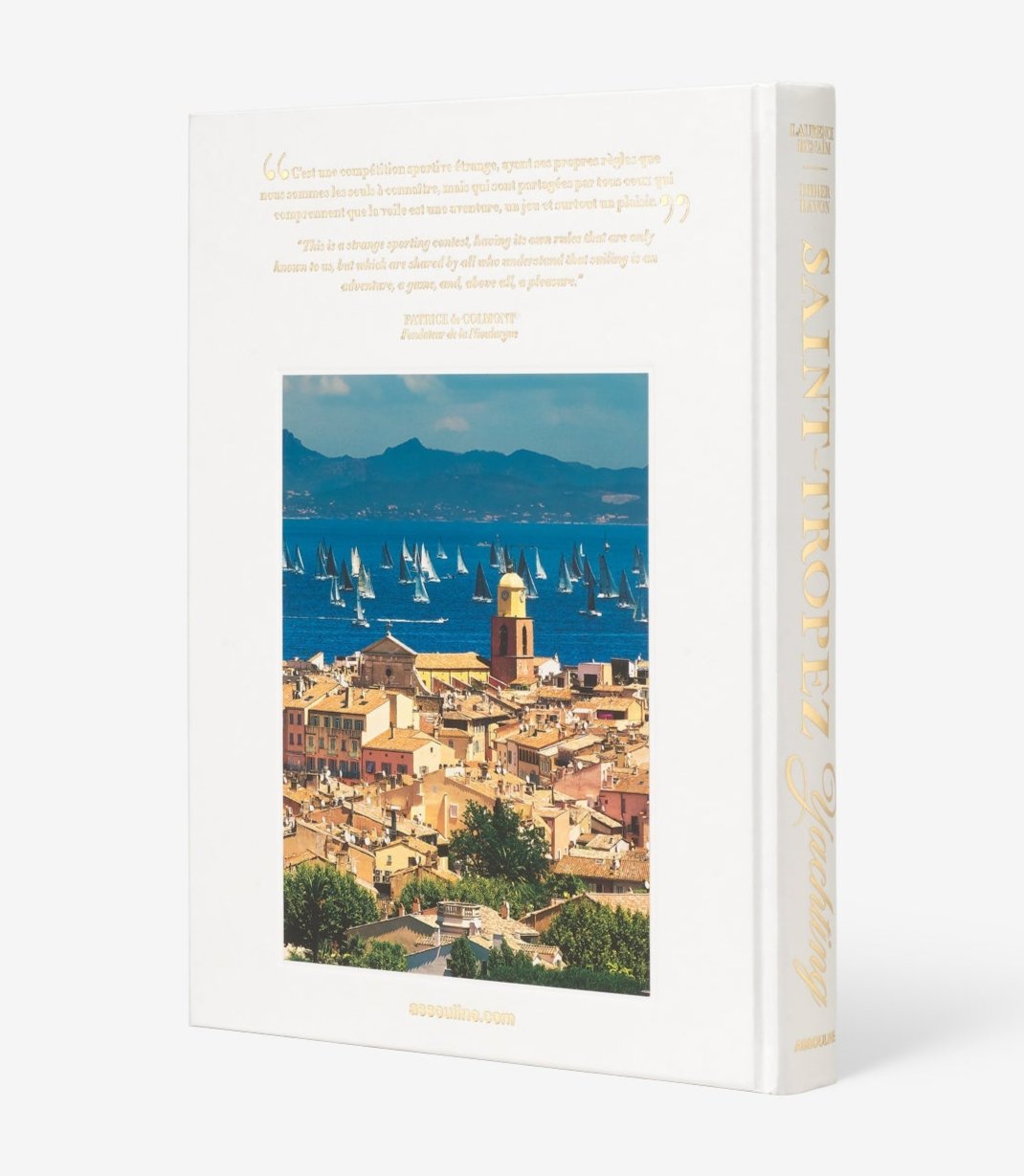 The book "Saint Tropez Yachting" by Assouline showcases a sunlit Mediterranean sailing scene with a charming seaside town and numerous sailboats, evoking the famous Voiles de Saint-Tropez.