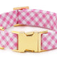 The Foggy Dog Fabric Dog Collar Collection features a pink and white checkered collar with a gold-color buckle and D-ring, displayed against a white background.