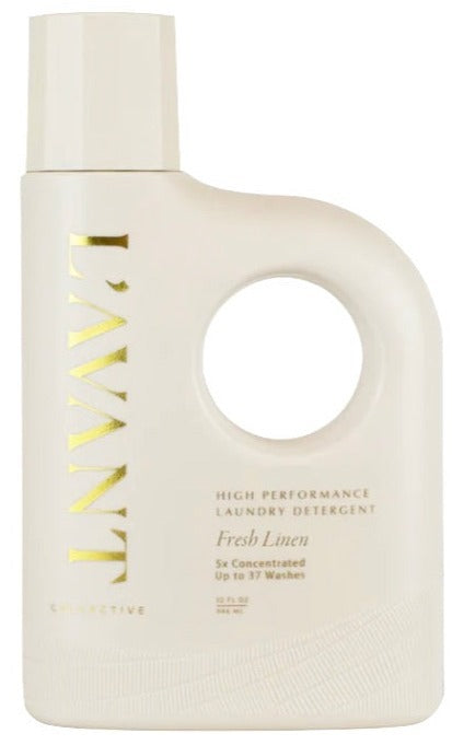 A bottle of L'Avant Collective Fresh Linen Scent Collection laundry detergent, 5x concentrated for up to 37 washes, delivers the same refined care as their luxurious hand soaps.