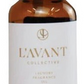 A brown glass bottle with a black cap labeled "L'Avant Collective Fresh Linen Scent Collection"—ideal for enhancing laundry detergent or pairing with their luxurious hand soaps.