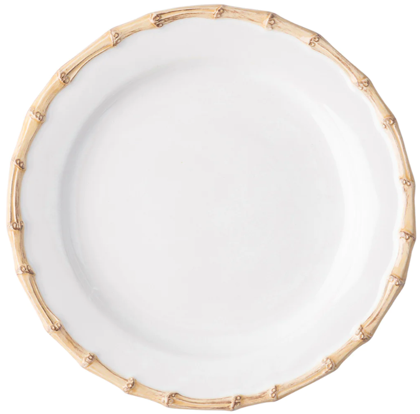 From Juliska's Classic Bamboo Dinnerware Collection, this white ceramic plate features a bamboo-inspired textured rim, adding casual elegance and global style to your table.