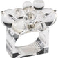 The Kim Seybert Cloud Napkin Ring features a clear Lucite band topped with clusters of rounded and teardrop-shaped acrylic baubles.