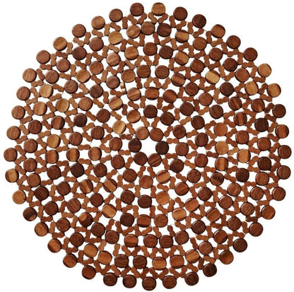 The Kim Seybert Bamboo Round Placemat features circular bamboo pieces in a geometric spiral, ideal for outdoor table décor or adding flair to formal settings.