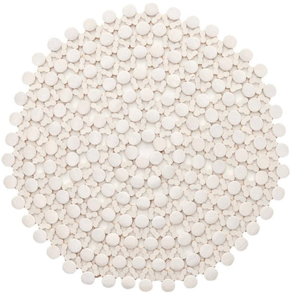 A dense arrangement of small, white tablets on a white background resembles the Bamboo Round Placemat by Kim Seybert, adding a touch of elegance to any formal tablescape.