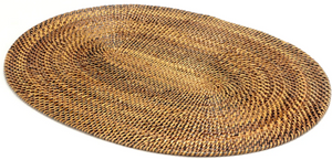 The Calaisio Oval Placemat is handcrafted from natural vines with a brown, tan, and black braided design, adding a rustic touch to your table.