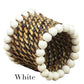 The Calaisio Woven Napkin Ring is handmade by artisans from South Pacific water-vines, detailed with white beads along the edges. Labeled "White" below.