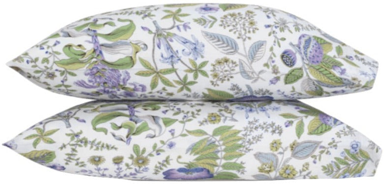 Two pillows from the Matouk Pomegranate Roman Linen Bedding Collection in Lilac are stacked on a white background, showcasing a green, purple, and blue floral pattern in OEKO-TEX Standard 100 certified soft Roman linen.