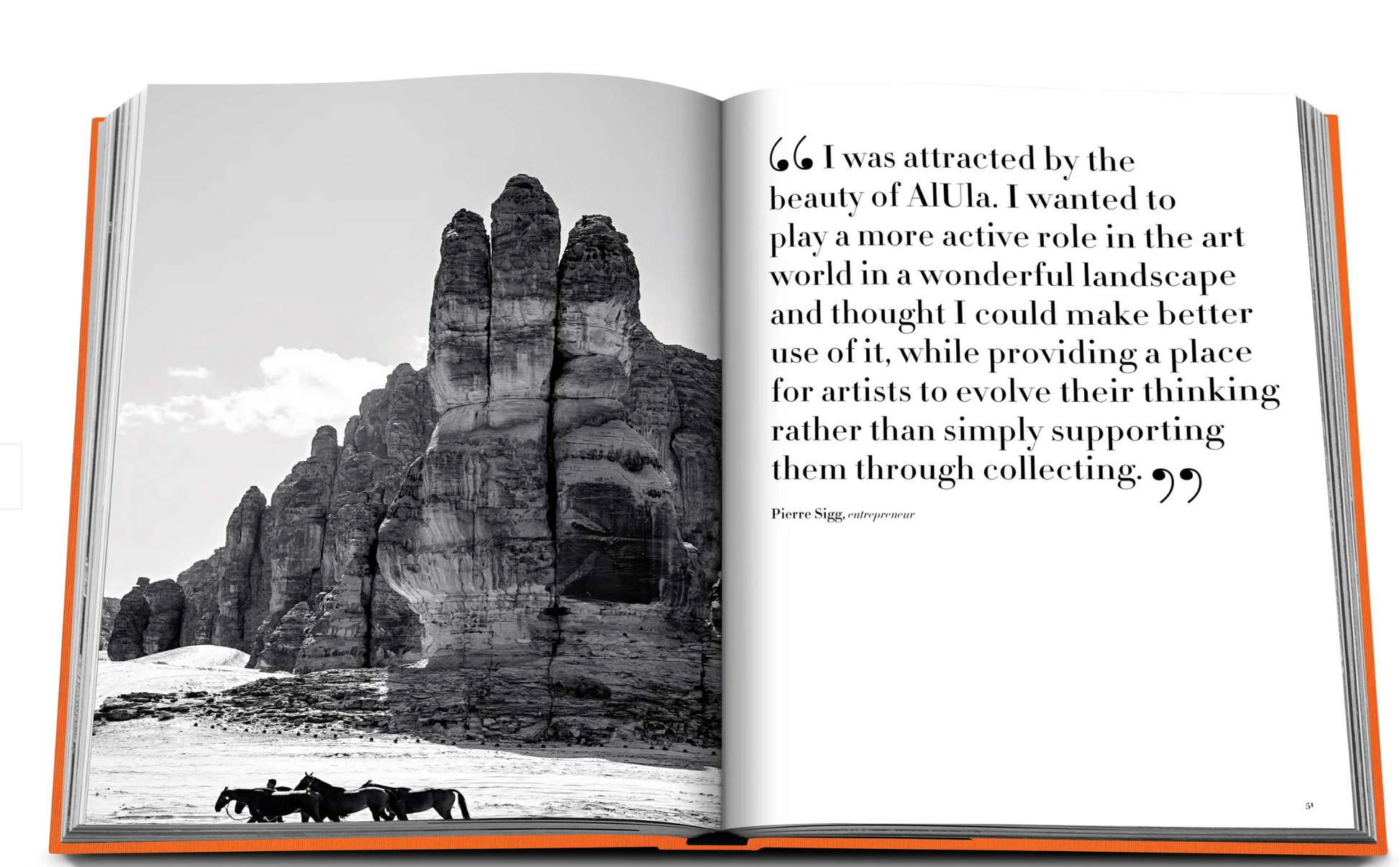 A black and white photo of large rock formations in a desert setting is on the left page of an open book. The right page contains a quote about the beauty of AlUla, a UNESCO World Heritage Site in Saudi Arabia, and its impact on an entrepreneur. The book is titled "AlUla Ever" by Assouline.