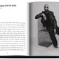Open Assouline magazine featuring an article titled "a trojan horse for the mind" with a black and white photograph of a seated man, identified as fashion designer Virgil Abloh, wearing Louis Vuitton: Virgil Abloh (Classic Cartoon Cover)