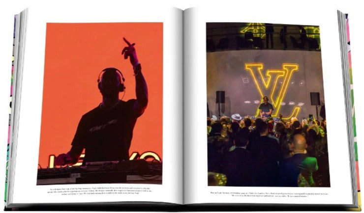 Open magazine displaying two photos of a dj performing at events with vivid lighting, featuring the Louis Vuitton: Virgil Abloh (Classic Cartoon Cover) by Assouline.