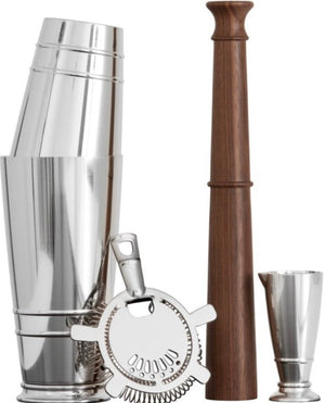 The Fortessa Crafthouse Shaker Set features a stainless steel shaker, strainer, jigger, and wooden muddler, all displayed upright against a white background.