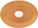 The Tresor Orange Large Oval Platter by Raynaud features a textured orange and gold patterned surface with a white center and elegant hand-painted details.