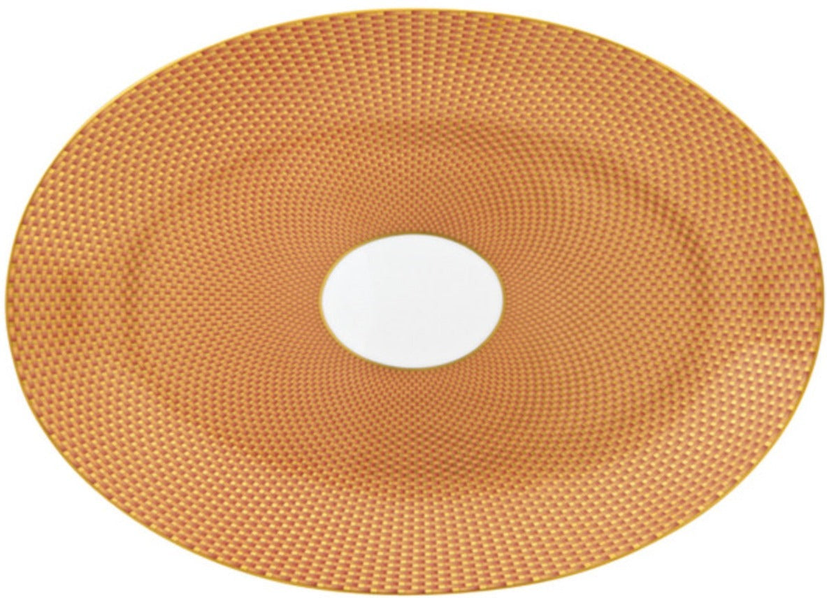 The Tresor Orange Large Oval Platter by Raynaud features a textured orange and gold patterned surface with a white center and elegant hand-painted details.