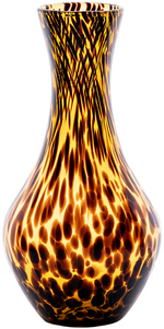 The Juliska Puro Tortoiseshell Carafe features a translucent brown glass with a yellow and brown tortoiseshell pattern and a flared rim—perfect for adding style to your dining table.