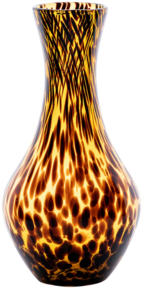 The Juliska Puro Tortoiseshell Carafe features a translucent brown glass with a yellow and brown tortoiseshell pattern and a flared rim—perfect for adding style to your dining table.