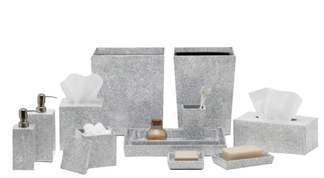 The Pigeon & Poodle Callas Bath Collection features silver speckled bathroom accessories—tissue box, soap dispenser, tray, sanitizer bottle, and wastebasket—all elegantly arranged with a mosaic touch.