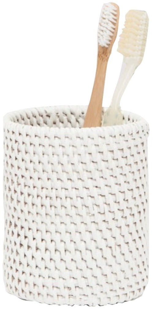 The Dalton Bath Collection by Pigeon & Poodle features a handmade rattan cup, elegantly holding one wooden and one plastic toothbrush, set against a white background.