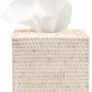 The Dalton Bath Collection by Pigeon & Poodle features a woven rattan tissue box holder with expert craftsmanship, shown with a white tissue partially pulled out.