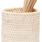 The Dalton Bath Collection by Pigeon & Poodle features a woven beige rattan cup, beautifully crafted to hold cotton swabs with wooden sticks—an elegant accent showcasing the brand's attention to detail.