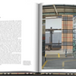 An open Burberry Book by Assouline reveals text about "The Scarf" on the left and shows an image of a loom weaving a classic British-style patterned scarf on the right.