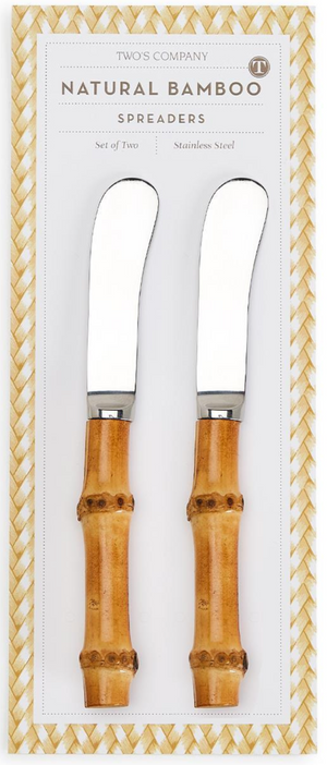 The Two's Company Natural Bamboo Handle Spreaders Set includes two spreaders with broad stainless steel blades and bamboo handles, packaged in a patterned box.