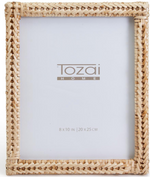 Display your favorite photo in the Two's Company Woven Rattan Frame, 8" x 10". This rectangular frame has a natural woven finish and a white insert with size info. Ideal for tabletop display.