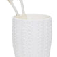 Two beige toothbrushes rest in a white Hilo Bath Collection cup by Pigeon & Poodle, featuring a textured sea urchin-inspired design.