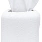 A roll of white toilet paper from the Hilo Bath Collection by Pigeon & Poodle, with a tissue pulled halfway out from the center, rests on a porcelain surface.