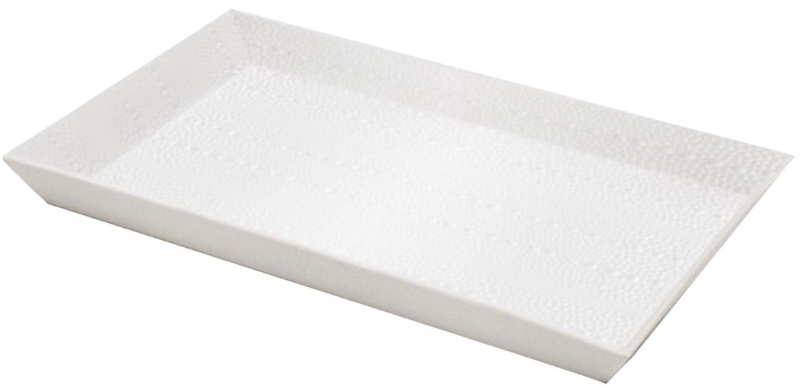 The Hilo Bath Collection by Pigeon & Poodle features a rectangular white porcelain serving tray with subtle sea urchin pattern and raised edges, displayed on a plain background.