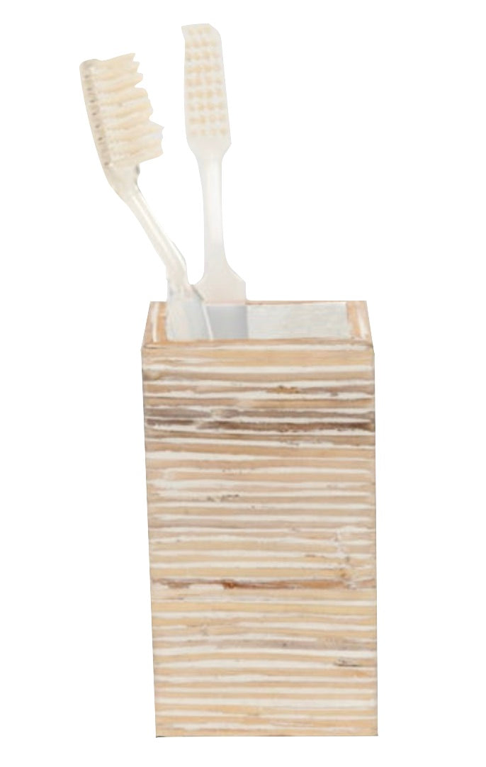 Two white toothbrushes in a rectangular, light wood holder from the Kona Bath Collection by Pigeon & Poodle, adding an island-inspired touch to your routine.