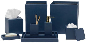 The Dannes Bath Collection by Pigeon & Poodle features navy blue bathroom accessories in faux waxed Belgian linen, including a tissue box, soap dish, tray, toothbrush holder, soap dispenser, waste bin, and storage containers.