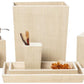 From Pigeon & Poodle's Maranello Bath Collection, this beige set includes painted wood accents, a waste bin, tissue box cover, soap dispenser, tumbler with combs, lidded jar, tray with decorative stone, and a soap dish with bar soap.