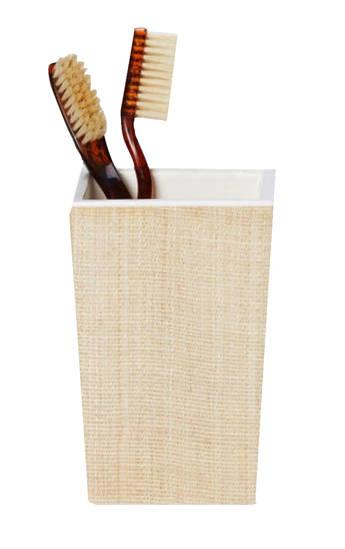 Two brown toothbrushes sit in a rectangular beige holder from the Pigeon & Poodle Maranello Bath Collection, crafted with abaca-resin, set against a white background.