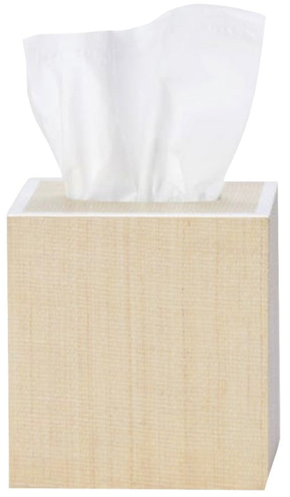 A tissue box from Pigeon & Poodle’s Maranello Bath Collection features a light wood texture with a white tissue partially visible at the top.