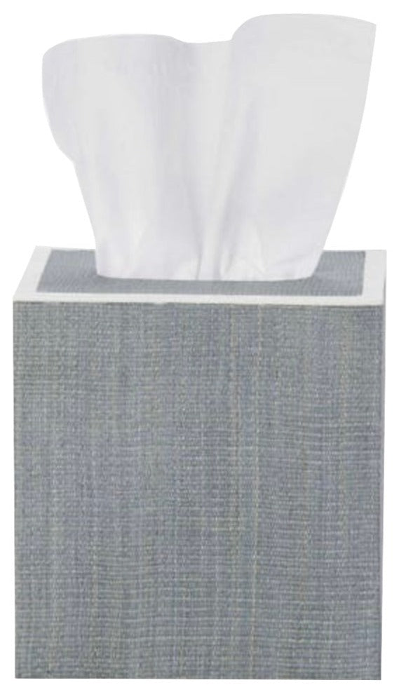 A square gray tissue box from Pigeon & Poodle’s Maranello Bath Collection, made with abaca-resin, displays a single white tissue partially pulled out from the top.