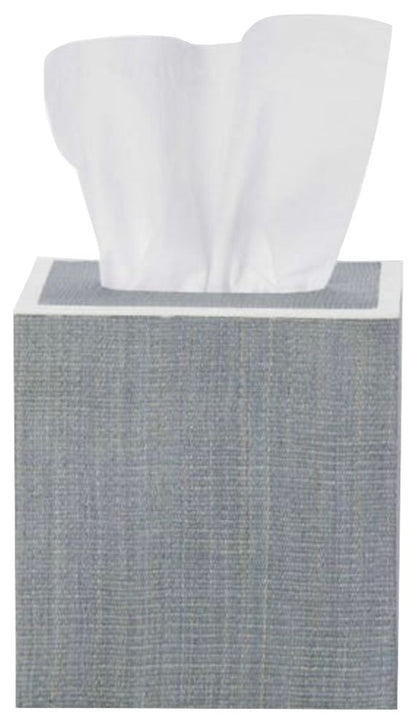 A square gray tissue box from Pigeon & Poodle’s Maranello Bath Collection, made with abaca-resin, displays a single white tissue partially pulled out from the top.