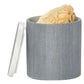 A gray cylindrical container from Pigeon & Poodle's Maranello Bath Collection with a separate white lid, containing a natural sponge inside.