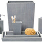 Part of the Maranello Bath Collection by Pigeon & Poodle, this gray set features abaca-resin accents and includes a wastebasket, tissue box, soap dispenser, canister, toothbrush holder, trays, sponge, and soap.