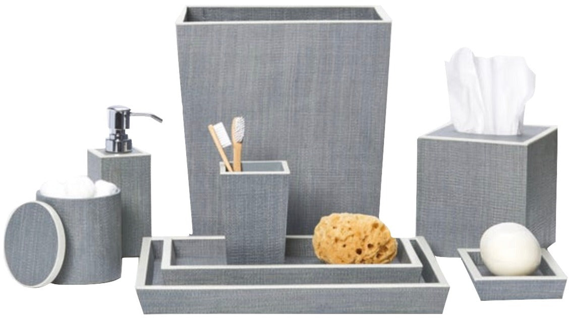 Part of the Maranello Bath Collection by Pigeon & Poodle, this gray set features abaca-resin accents and includes a wastebasket, tissue box, soap dispenser, canister, toothbrush holder, trays, sponge, and soap.